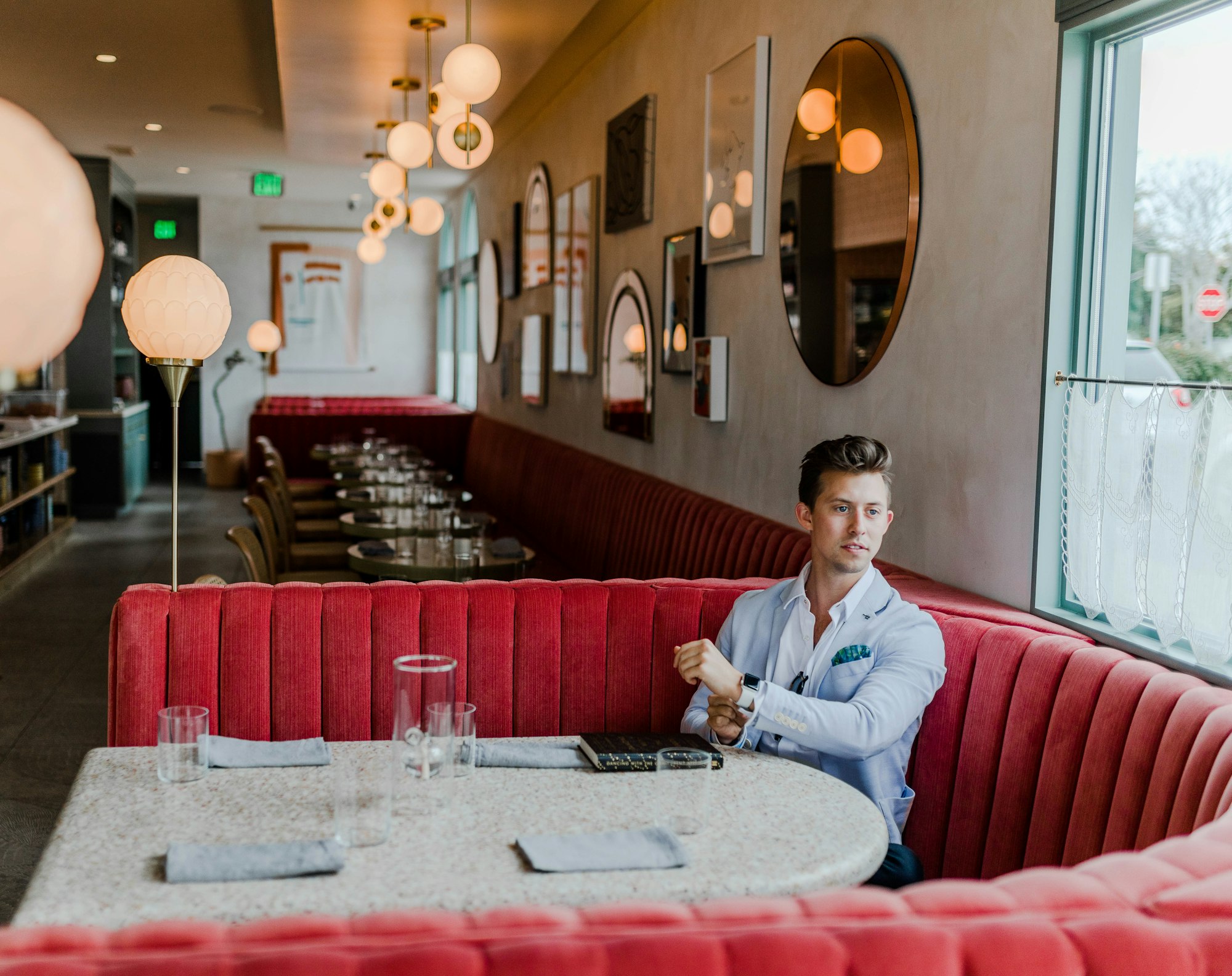 A customer alone at a restaurant table after the conversation, nothing yet resolved.